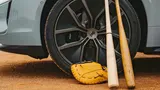 Porsche Taycan Turbo S and baseball equipment